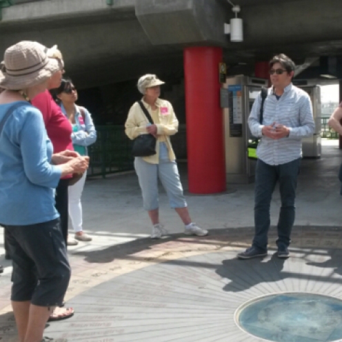 Artist Sam Lee conducted the tour, beginning with the history of the art at the Chinatown station.